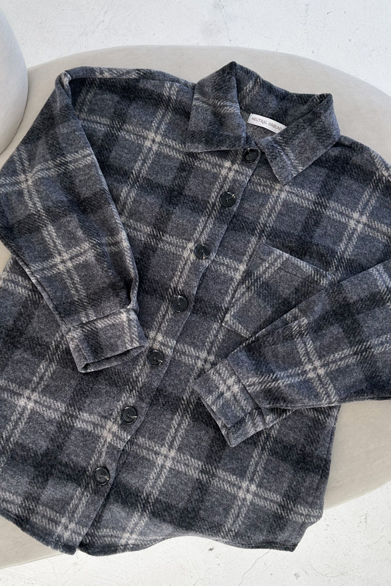 Plaid shirt on a white surface