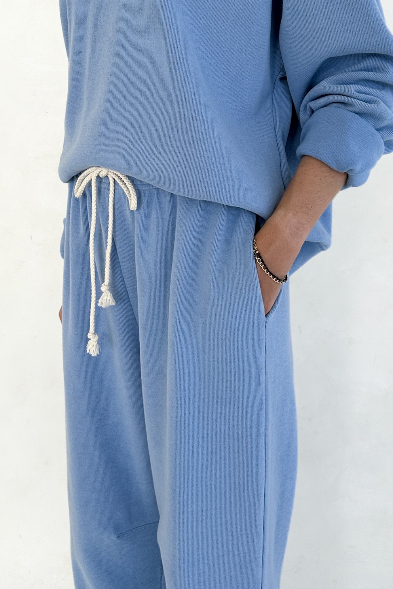 Blue tracksuit with a white background