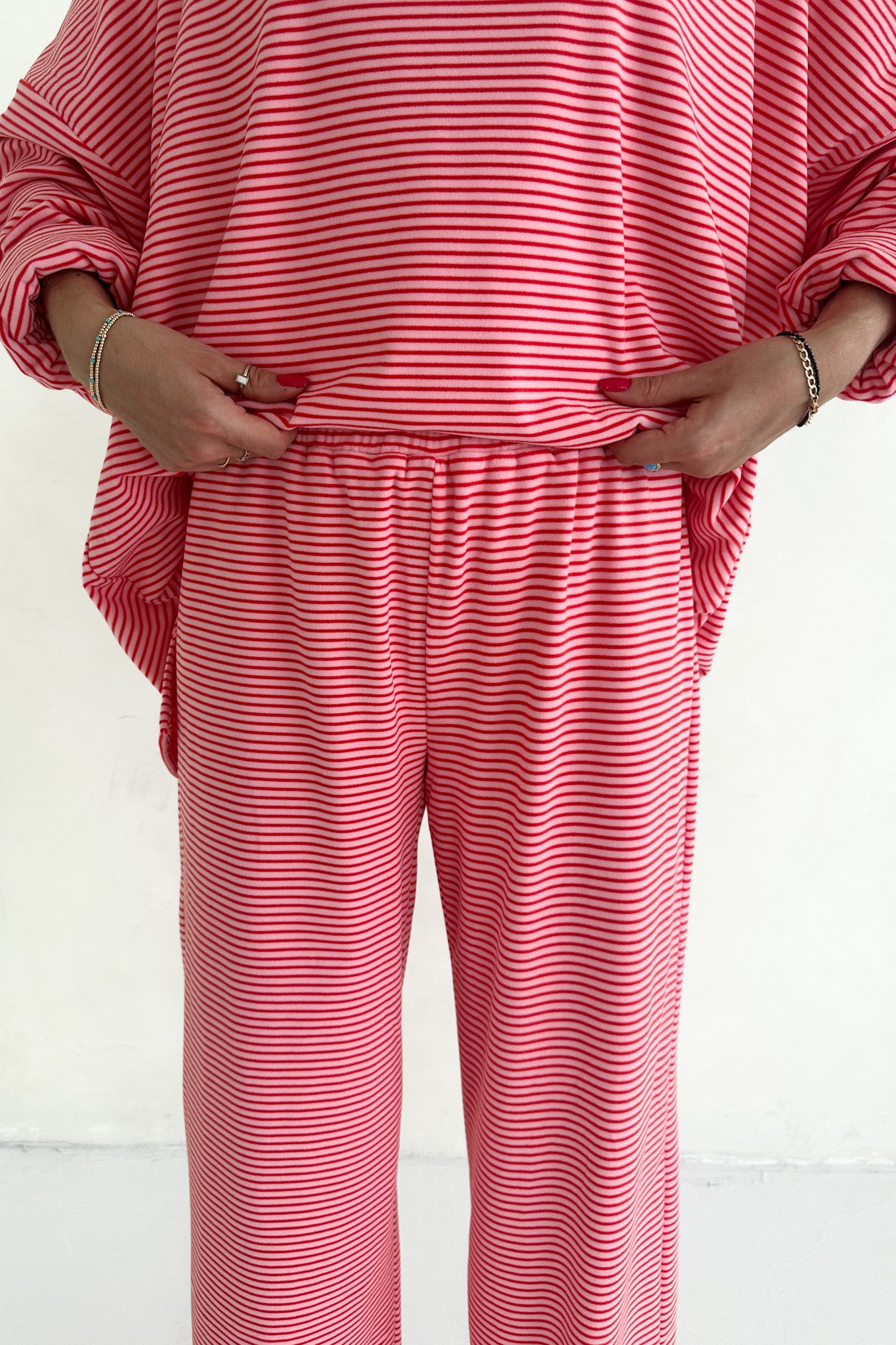 Red and white striped outfit on a plain background