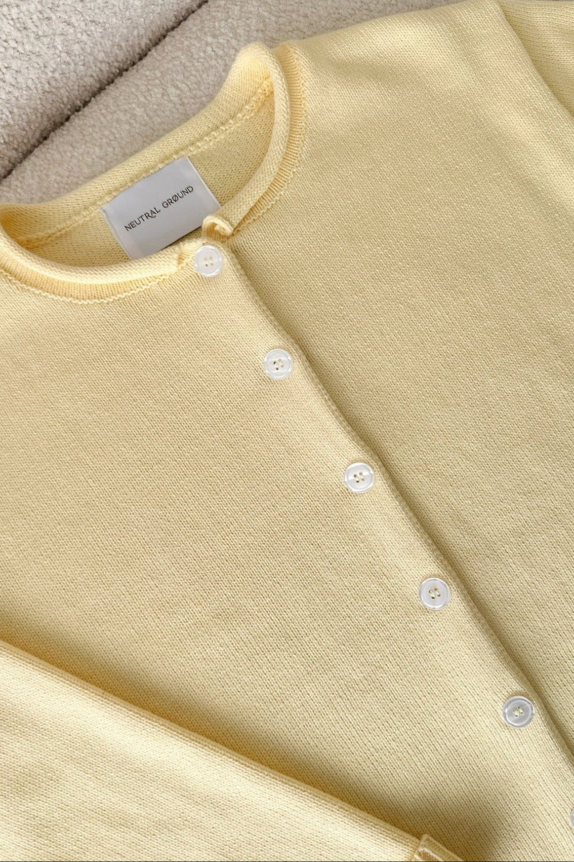 Daisy Rolled Neckline Button Up Cotton Cardigan in Sunshine - Neutral Ground