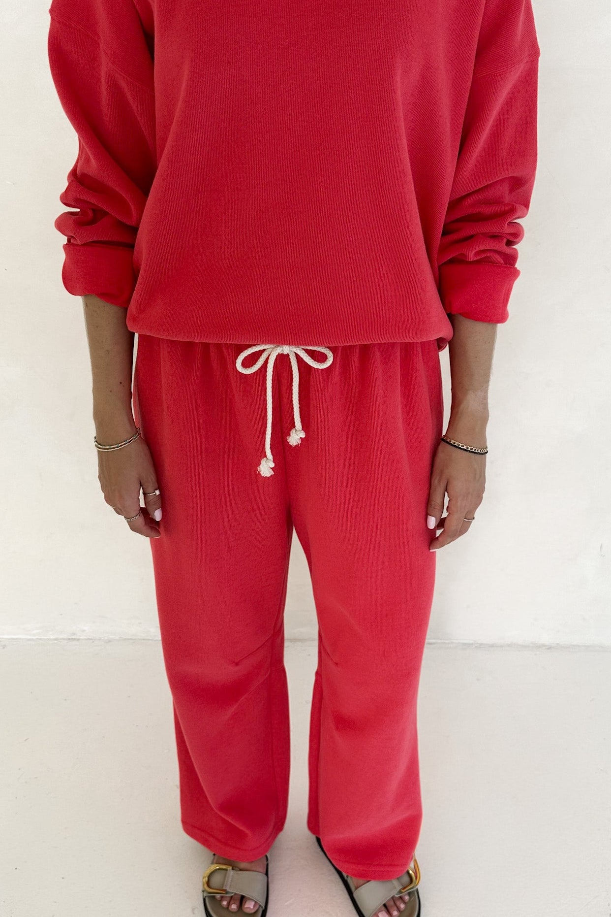 Person wearing a red outfit with a white background