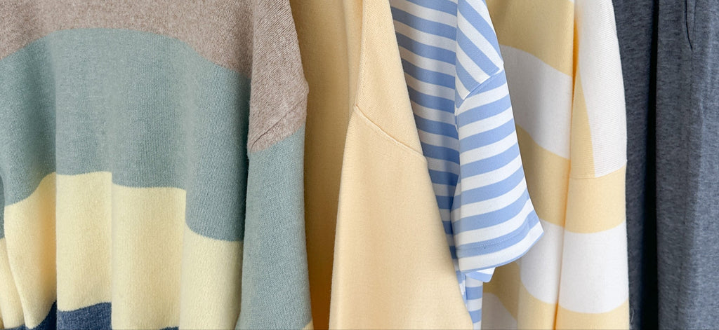 Close-up of colorful striped clothing on a rack