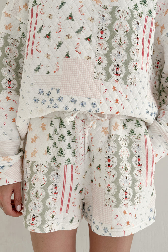 Patterned pajama set with long-sleeve top and shorts on a neutral background